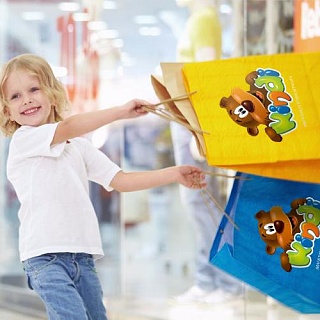 Логотип и фирменный персонаж сети детских магазинов